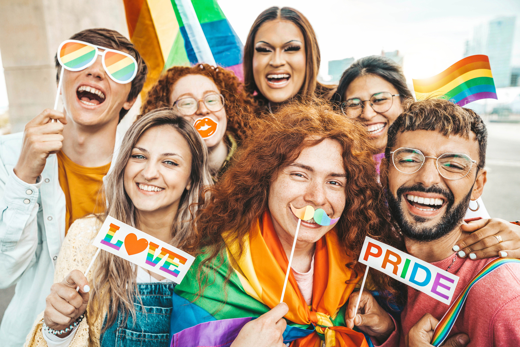 Diverse group of young people celebrating gay pride festival day
